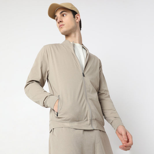 Regular Fit Solid Jacket with 2 Zip Pockets. Lightweight, Breathable and Perfect for all weather.